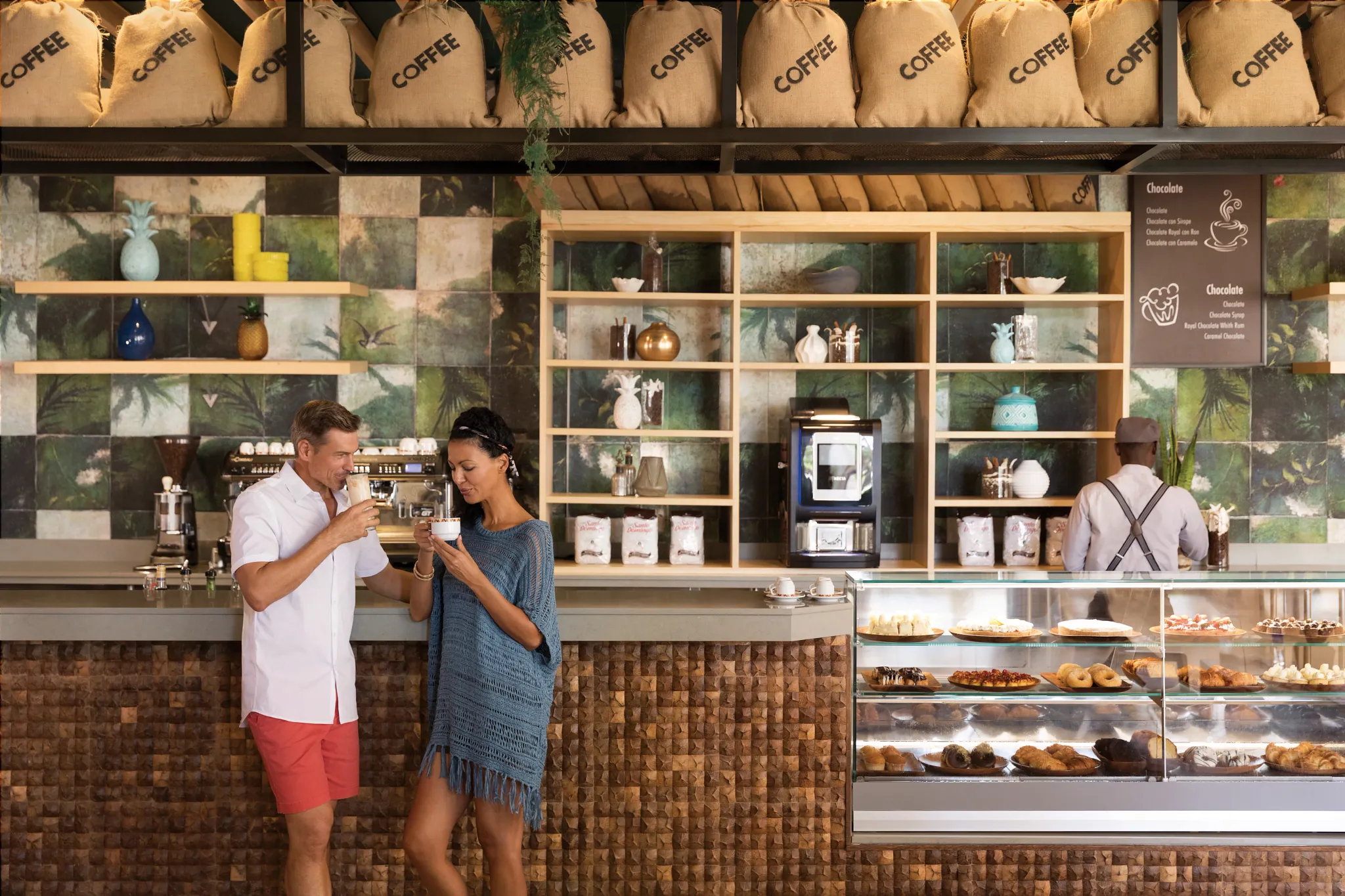 Aroma Café at Secrets La Romana Resort & Spa featuring a cozy coffee lounge, fresh pastries, and modern café seating.