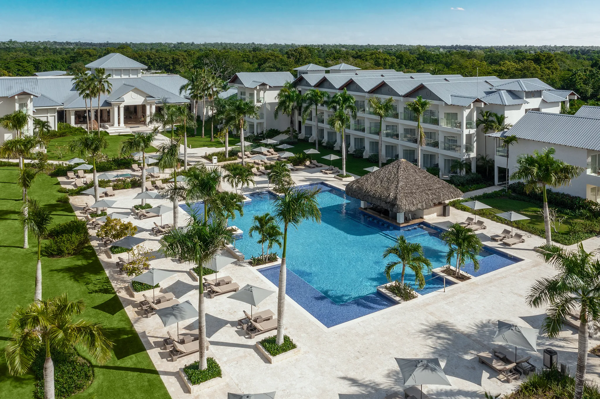 Preferred Club Swim-Up Bar at Secrets La Romana Resort & Spa featuring an exclusive poolside bar, tropical cocktails, and luxurious resort ambiance.