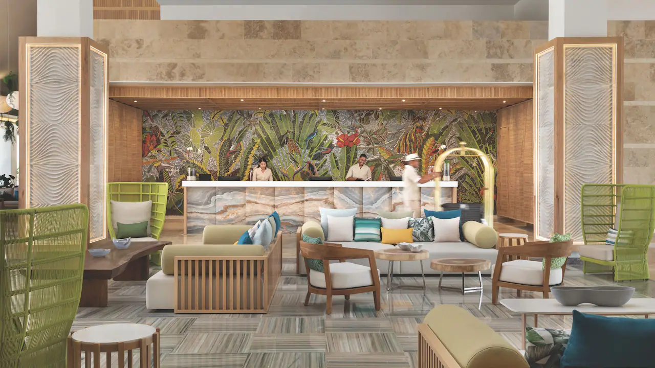 Modern resort reception area with tropical décor at Secrets La Romana Resort & Spa.