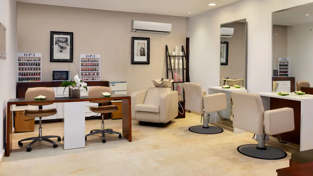 Luxury spa salon with manicure and beauty stations at Secrets La Romana Resort & Spa.